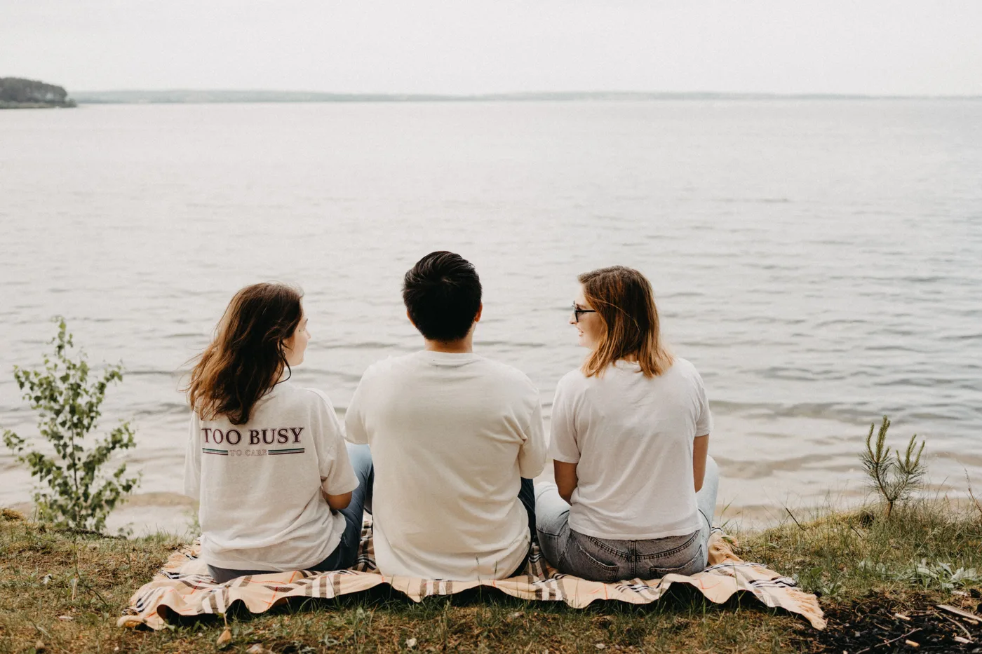 Three friends sharing an unhurried afternoon by the sea