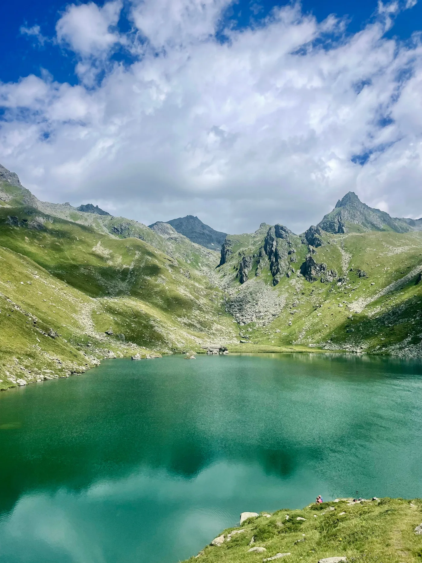 A turquoise lake in a green mountain valley